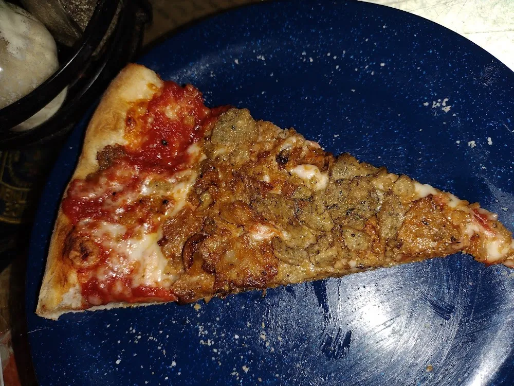 Slice of Pizza with Sausage and Pepperoni